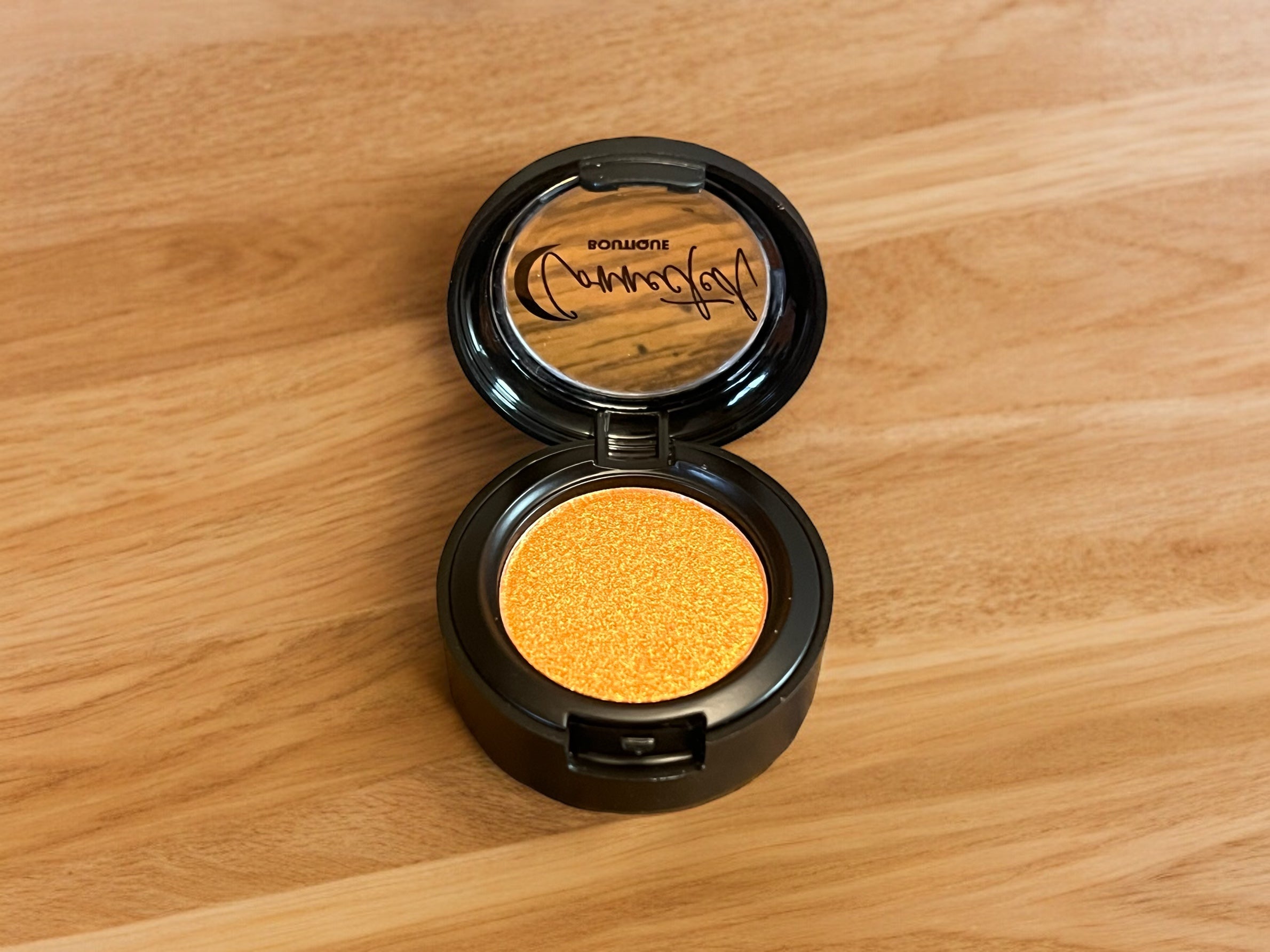 Astral Kiss orange shimmer single eyeshadow
